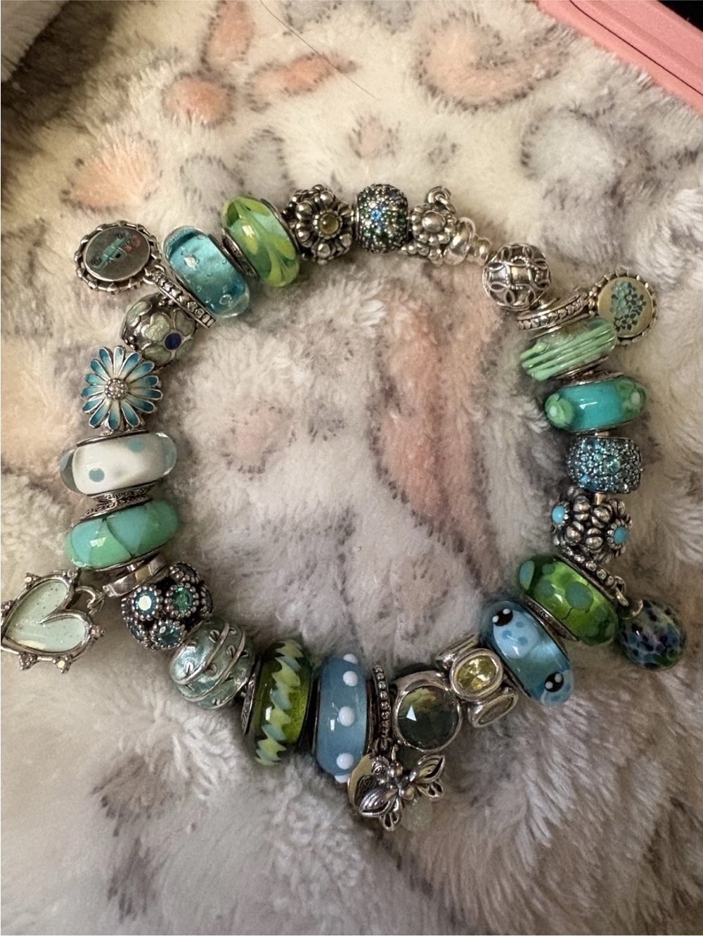 Pandora bangle with teal/green pandora charms